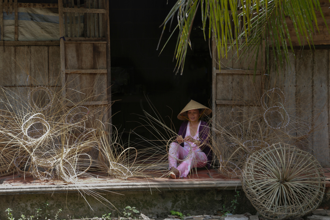 Person making Wicker Baskets 