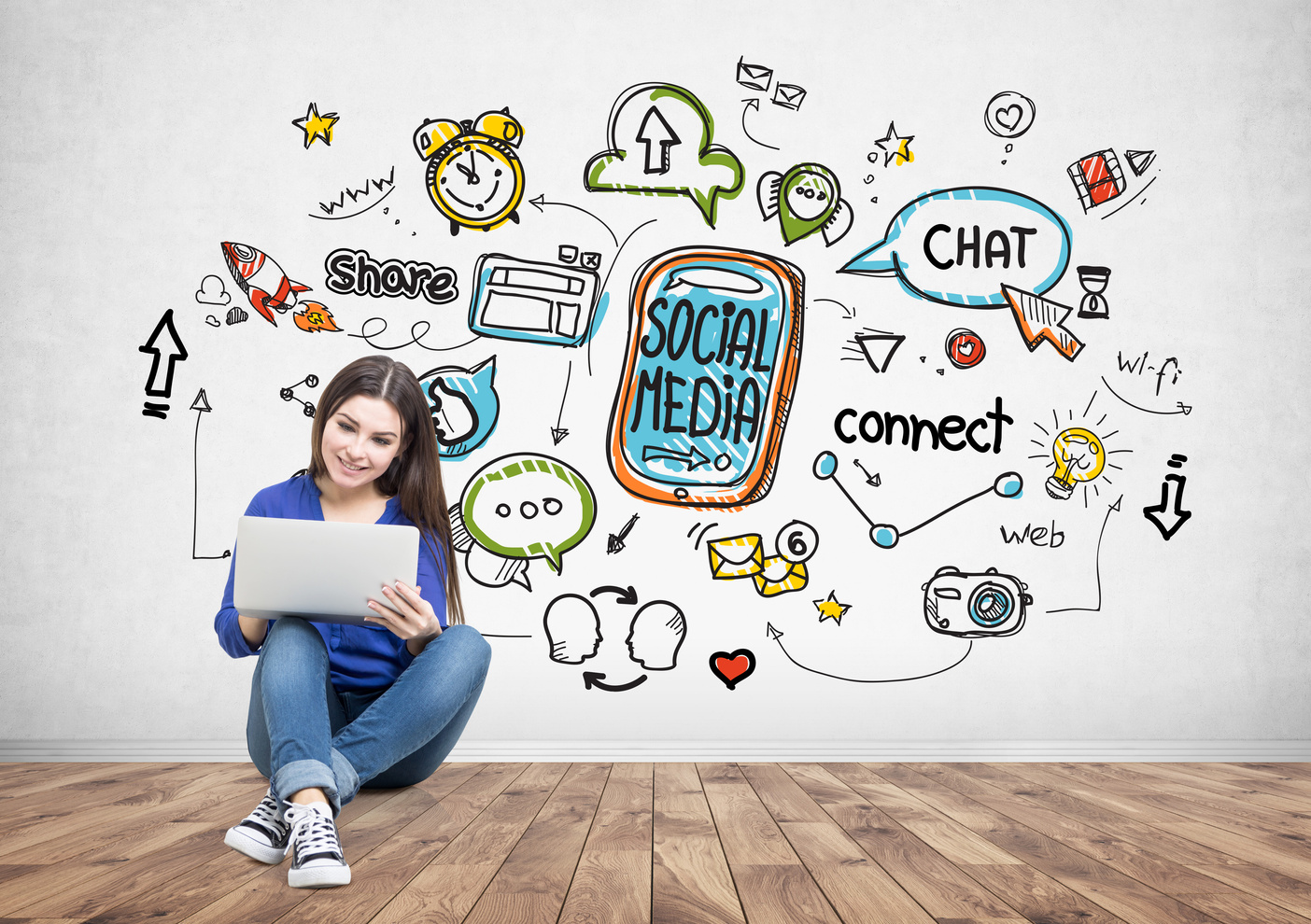 Teenage girl in jeans holding a laptop, social media