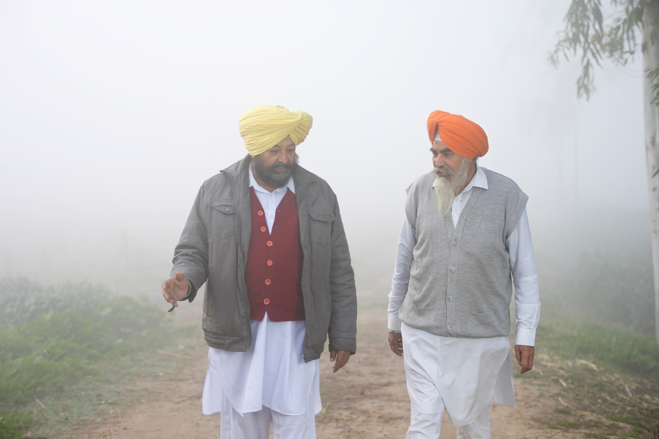 Two Indian farmers discussing