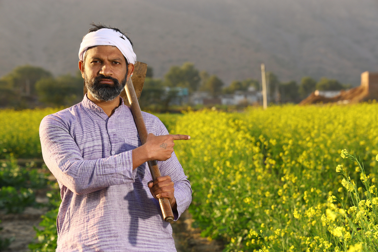 Angry Indian farmer standing .